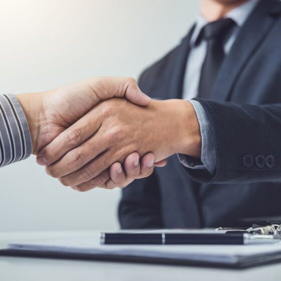 Handshake of customer and salesman after handshake
